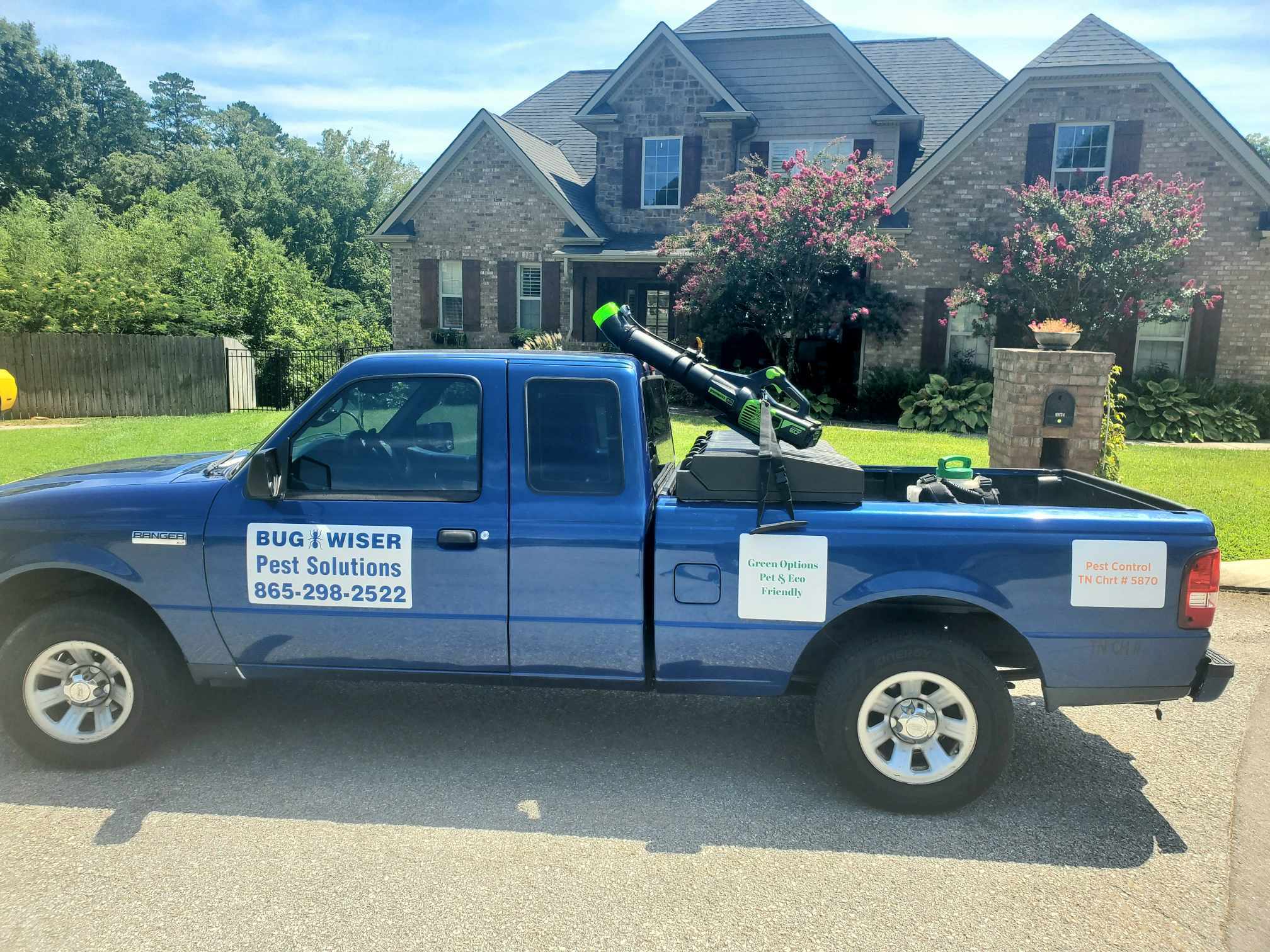 Bug-Wiser truck parked in front of an East Tennessee home